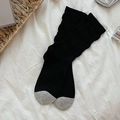 Black and grey color-block ribbed knit crew socks in a cozy minimalist flat lay - One Size / Black (Grey Toe)