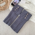 Grey cable-knit leg warmers with wood buttons and ribbed cuffs for a retro autumn style - Gray