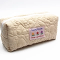 Quilted heart pattern makeup bag in beige with floral patch and Lucky Flower text - Heart Quilted (Lucky Flower) / Beige