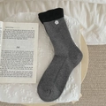 Grey mid-calf knit socks with black ribbed cuffs and 3D white floral button accent - One Size / Dark Gray
