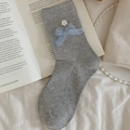 Grey rib-knit crew socks featuring a light blue plush bow and delicate white flower - Light Gray