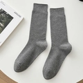 Heather gray ribbed knit crew socks in a minimalist flat lay on a white background - One Size / Dark Gray