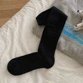 Classic black ribbed knit knee-high socks for women in stylish autumn winter style - One Size / Black
