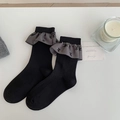 Black ballet-style ribbed socks with grey ruffled edges and delicate bow-knot details - One Size / Black