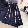 Navy blue knit leg warmers with star cutouts and white drawstrings in a stylish flat lay - One Size / Dark Blue