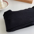 Primer plano de medias negras de punto que muestra su textura elástica y suave - Talla única / Negro