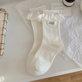 Cream white mid-calf socks with ruffle trim and grey MD embroidery detail - White Lace Trim