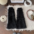 Furry black faux fur leg warmers with adjustable knit drawstrings in a cozy winter setting - Black