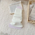 Ivory white ribbed knit leg warmers with soft texture in cozy home setting - One Size / White