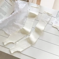 Vertical ribbed white knit leg warmers in a balletcore style for autumn and winter - One Size / White