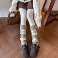 Knit leg warmers with snowflake pattern and ribbed cuffs on warm wooden background - One Size / Khaki