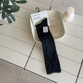 Chic black ribbed knee-high socks in minimalist packaging for a trendy academic style - One Size / Black