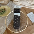 Dark brown crew socks with white polka dots and ribbed texture in a woven basket - One Size / Coffee
