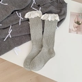 Gray knit knee-high socks with white lace floral trim and elegant hollow embroidery detail - One Size / Gray