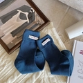 Dark blue ribbed cotton socks with folded cuffs and white fabric label on cozy blanket - One Size / Blue