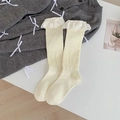 Creamy white pointelle knit knee-high socks with delicate floral lace ruffle cuffs - One Size / Beige