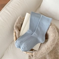 Light blue ribbed crew socks for women displayed in a cozy wicker basket - One Size / Blue