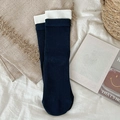 Dark blue ribbed crew socks with white cuffs in a flat lay minimalist aesthetic - Dark Blue