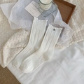 White vintage ruffled mid-calf socks with vertical ribs and elegant metal button detail - One Size / White