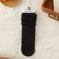 Japanese style black slouch socks with vertical ribbed texture and cotton knit fabric - One Size / Black