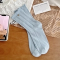 Light blue mid-calf ribbed socks with ruffled trim and decorative silver button detail - One Size / Blue