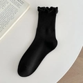 Calcetines media pantorrilla negros para mujer con borde de volantes y textura acanalada - Negro