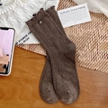 Dark brown ribbed socks with ruffle hem and vintage button detail on wooden surface - One Size / Dark Coffee
