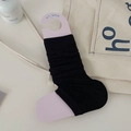 Black ribbed ballet style leg warmers on a purple display card with a minimalist aesthetic - One Size / Black