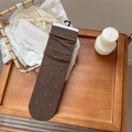 Deep brown knitted crew socks with purple floral embroidery and vintage hanging tag - One Size / Coffee