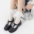 Schwarze Mary Jane T-Riemchen Schuhe mit weißen Spitzen-Söckchen und Schleifen-Details - Beige