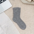 Grey knit mid-calf socks featuring white bow accents and hollow mesh texture - One Size / Gray