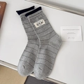 Gray striped cotton crew socks with Kiki sox label and ribbed cuffs on white background - One Size / Gray