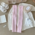 Pink ribbed knit leg warmers in a soft winter style for women, cozy and stretchable - One Size / Pink