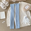Light blue ribbed knit leg warmers in a cozy winter lifestyle flatlay setting - One Size / Blue