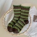 Retro green and brown striped mid-calf socks with rolled cuffs in a woven basket - One Size / Green Coffee Stripes