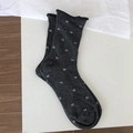 Dark grey crew socks featuring white bow patterns and stylish rolled edge cuffs - One Size / Dark Gray