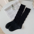 Classic black knee-high socks with bubble texture and elastic knit design for a stylish look - One Size / Black
