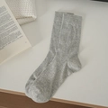 Classic grey loose knit crew socks with ribbed cuffs on a white textured background - One Size / Gray