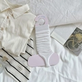White ribbed knit leg warmers in ballet style shown with aesthetic props on bed - One Size / Bleached White