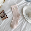 Sweet light pink baby crew socks with ruffled cuffs and cream bow decoration - One Size / Pink