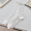 White crew socks with delicate ruffle trim and vertical pointelle knit texture - One Size / Bleached White