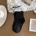 Sweet black ballet style socks with white lace trim and ribbons on wooden background - One Size / Black