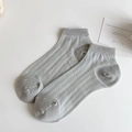 Light grey openwork knit ankle socks with diamond mesh pattern in a minimalist style - One Size / Gray