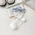 White ribbed crew socks with blue checkered lace trim on a clean vintage book - One Size / White Base Blue