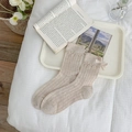 Beige mid-calf cotton socks featuring vertical stripes and a side ribbon bow accent - Brown