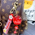 Roter Wal-Glaskugel Schlüsselanhänger mit Glitzerblume und Honey-Armband - Rote Sakura