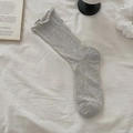 Light gray cotton mid-calf socks with ribbed texture and elegant ruffled cuff design - One Size / Light Gray