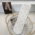 White mesh crew socks with black polka dots and vertical hollow patterns in a basket - White with Black Polka Dots