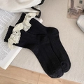 Black cotton socks with white wide lace trim and floral embroidery in a vintage setting - One Size / Black
