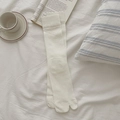 Minimalist beige two-toe split socks with ribbed knit texture and wide elastic cuffs - Creamy White
